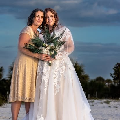 Bride and bridesmaid portrait on the beach