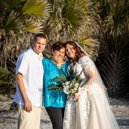 Bride groom and mother at tropical beach wedding