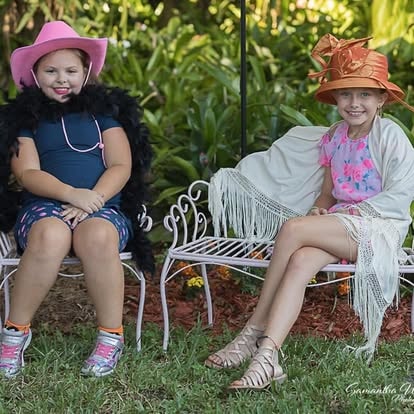 Two children wearing cowboy hats