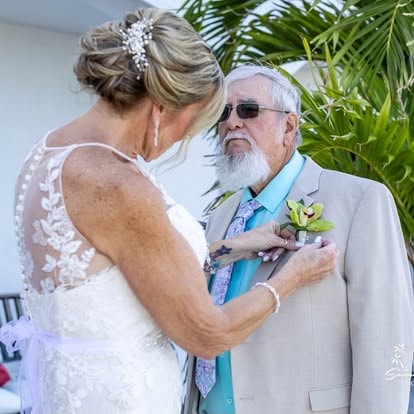 Older couple wedding ceremony embrace