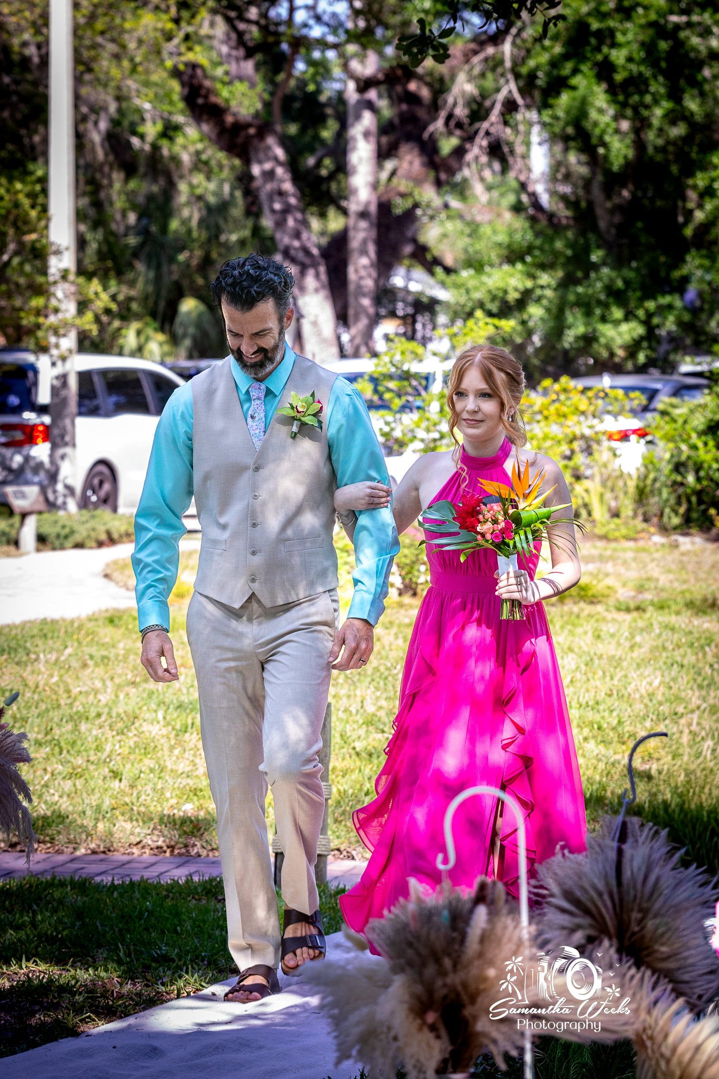 Couple walking outdoor wedding ceremony garden